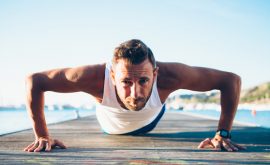 Healthy fit man exercising push ups